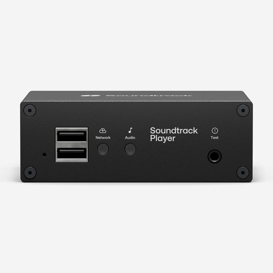 The front of a Soundtrack Player. USB ports for maintenance, network and audio LEDs, as well as a headphone output for testing.